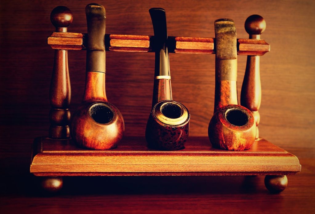 A row of pipes which need to be filled with pipe tobacco.