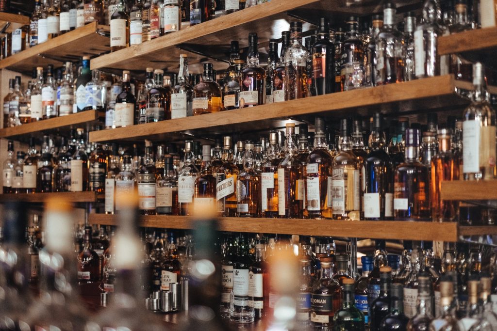Collection of whisky behind a bar
