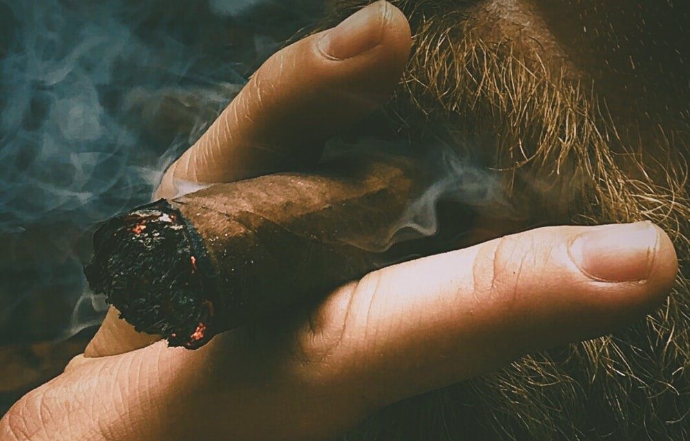 man smoking a cigar