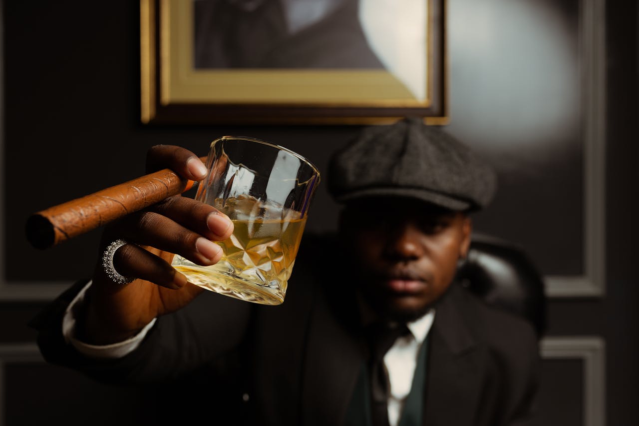 man with whisky and a cigar