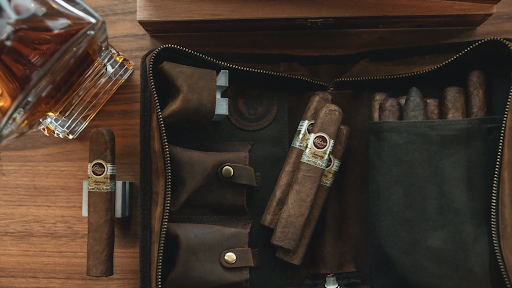 A collection of cigars in a leather pouch